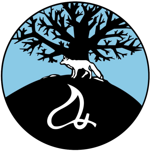 http://The%20Mashantucket%20Pequot%20Tribal%20Nation%20tribal%20seal,%20featuring%20an%20all%20white%20fox,%20standing%20on%20a%20black%20hill%20under%20a%20large%20bare%20tree,%20set%20against%20a%20blue%20background%20with%20a%20large%20cultural%20symbol%20in%20white%20at%20the%20bottom.